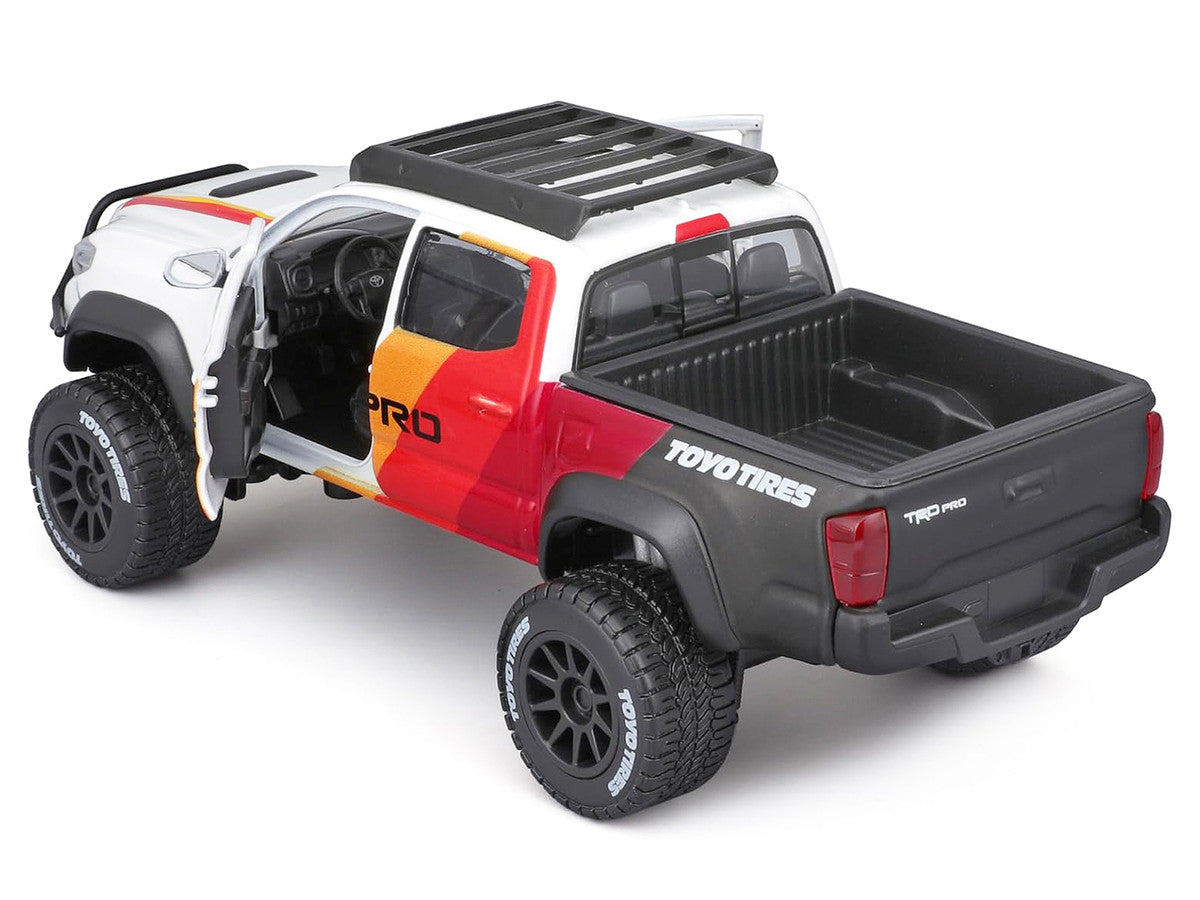2023 Toyota Tacoma TRD PRO Off Road Pickup Truck White with Graphics and Roof Rack "Maisto Design" Series 1/27 Diecast Model Car Maisto-1