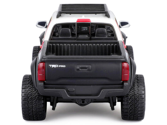 2023 Toyota Tacoma TRD PRO Off Road Pickup Truck White with Graphics and Roof Rack "Maisto Design" Series 1/27 Diecast Model Car Maisto-0